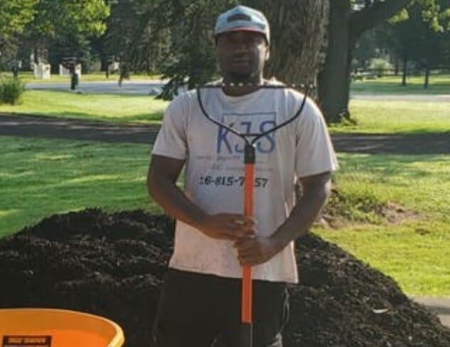 Errick Johnson an employee at Kevin J Services working in the field.